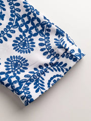 Blue and white printed romper sleeve detail
