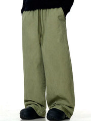 Relaxed wide-leg drawstring trousers in army green with a comfortable fit.