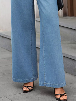 Light wash denim wide-leg pants with a clean front and flared hem.