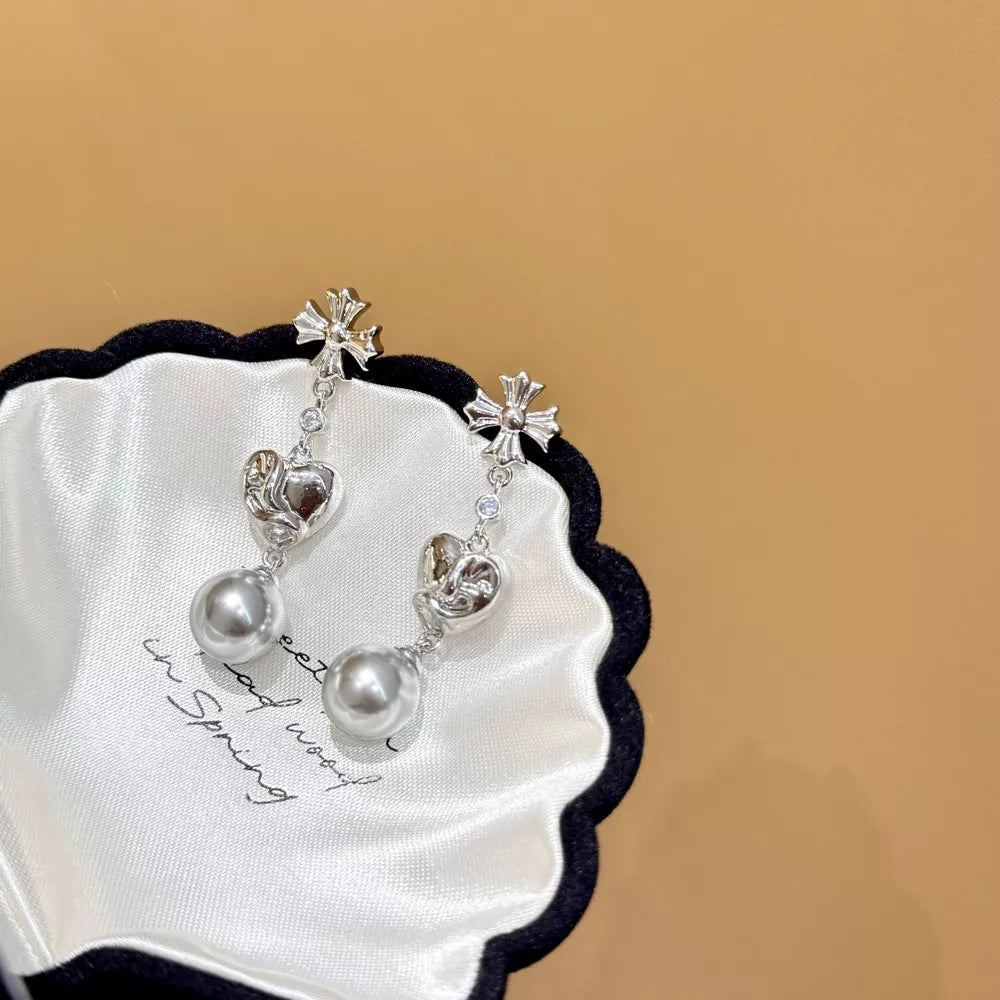 Sophisticated pearl heart drop earrings in gray with silver cross accents.