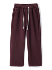 Burgundy relaxed fit men's sweatpants with white drawstring and side pockets.