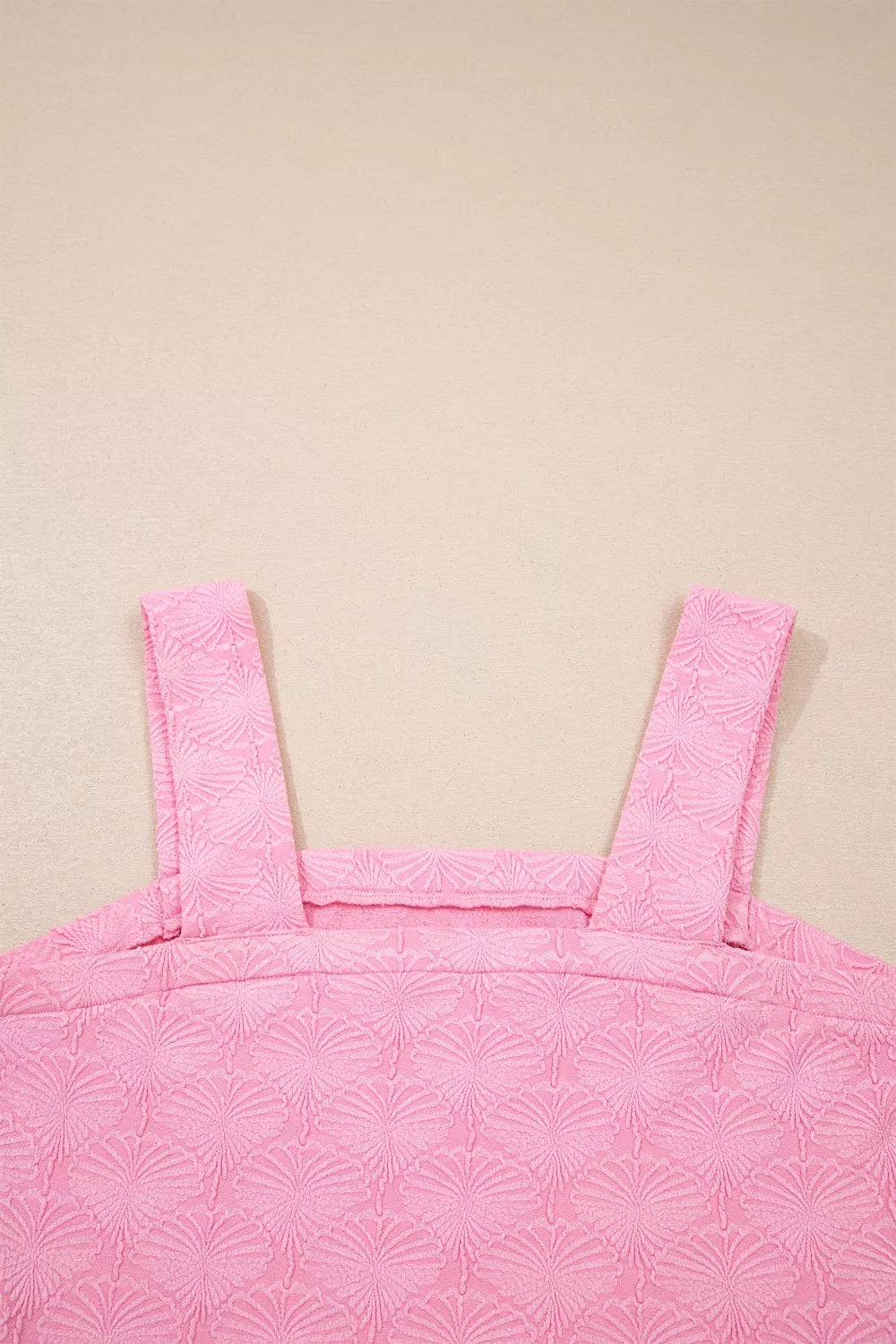 Pink textured square neck tank top with wide straps and a fan pattern.