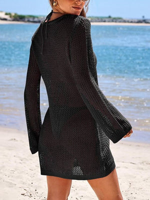 Black openwork knit cover-up dress with long sleeves and keyhole detail.