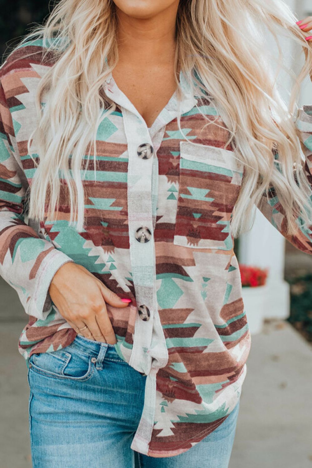 Southwestern print button-down blouse with a pocket and button details, styled with jeans.