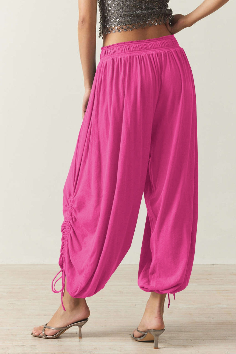 Hot pink gathered ankle-tie balloon trousers with drawstring detail