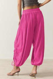 Hot pink gathered ankle-tie balloon trousers with drawstring detail