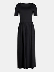 Black textured wide-leg jumpsuit with short sleeves and subtle elastic waist