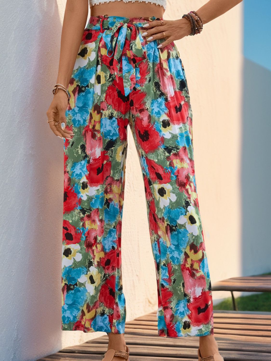 Painterly floral wide-leg trousers with a tie waist in multicolor.