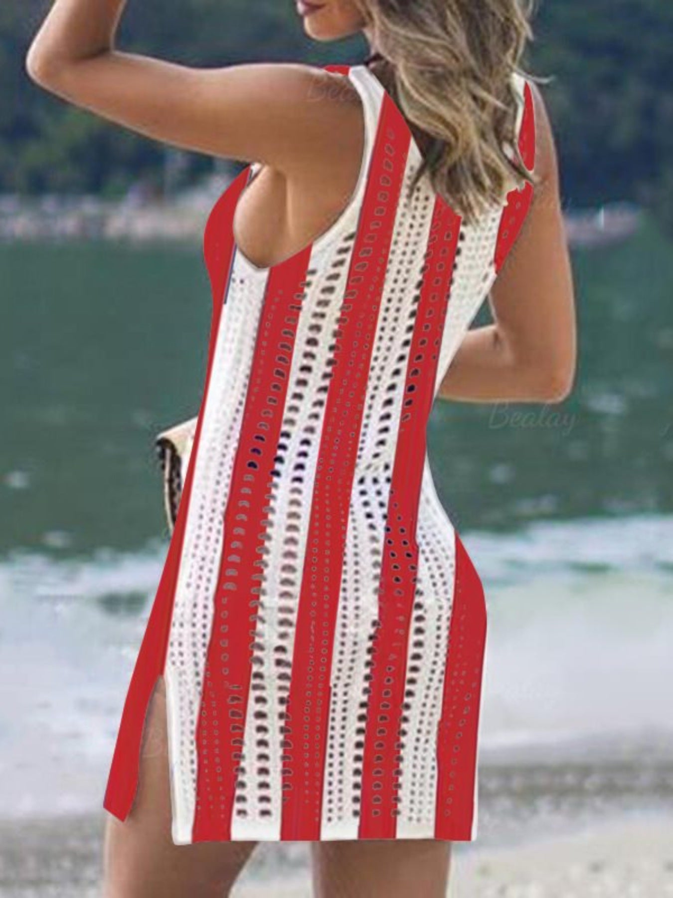 Multicolor openwork knit swim dress with side slits and tassel trim.