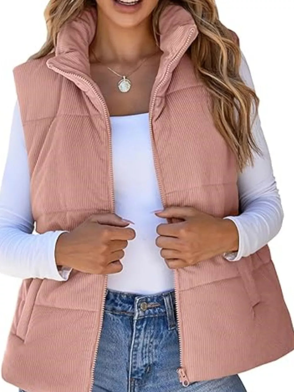 Pink ribbed corduroy zip-up vest coat with stand-up collar.