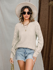 Tan diamond-cut raglan knit sweater with crew neck and long sleeves.