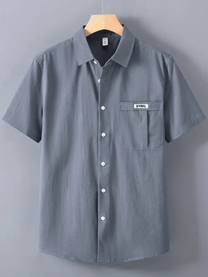 Men's dark gray short-sleeve button-up shirt with a chest pocket and white buttons.