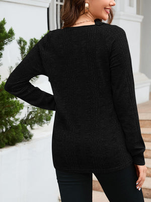 Black textured raglan sleeve knit top with a relaxed fit.