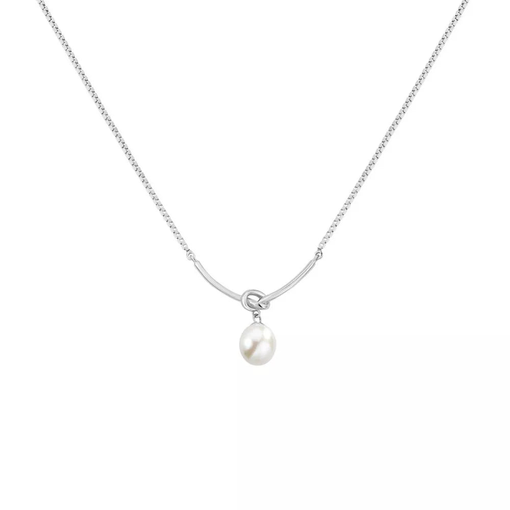 Silver pendant necklace with a single pearl and knot detail on a delicate chain.