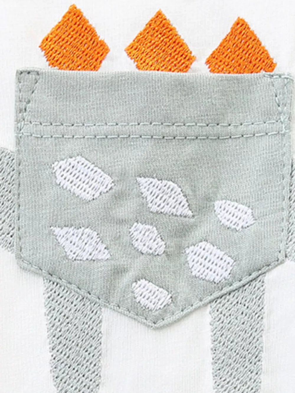 Toddler boys' cotton tee with dinosaur appliqué and pocket detail.