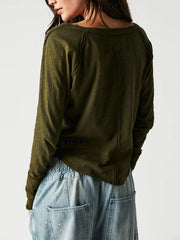 Army green distressed long sleeve tee with slouchy fit and subtle logo detail.