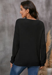 Black relaxed knit V-neck pullover sweater with long sleeves.