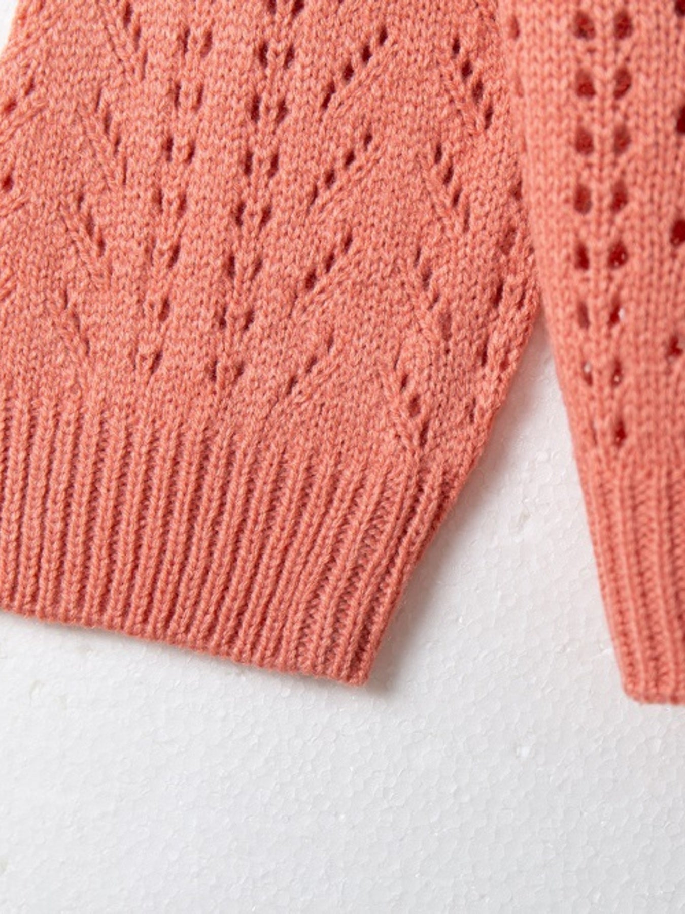 Burnt Coral chevron knit maternity cardigan with openwork detail and ribbed hem.