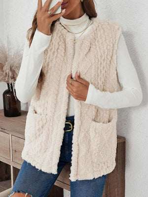 Textured sherpa open-front vest in dust storm with two front pockets.