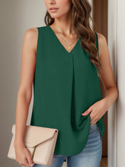 Sleeveless dark green v-neck blouse with front pleats.