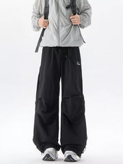 Black cargo sweatpants with adjustable waist and mesh side panels.