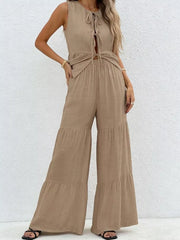 Beige tie-front ruffled sleeveless top with tiered wide-leg pants set