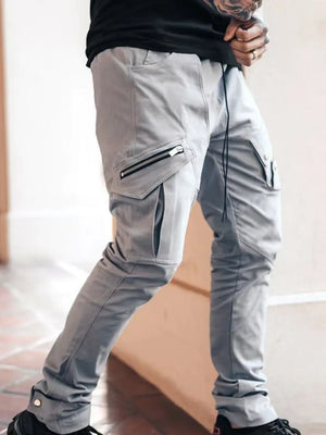 Gray zip pocket slim cargo trousers with drawstring waist and button cuff detail.