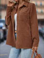 Brown corduroy shirt jacket with stud detail on collar and chest pocket, button front, and long sleeves.