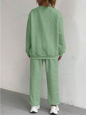 Textured cable knit loungewear set in Gum Leaf green, featuring a crewneck sweatshirt and wide-leg pants.