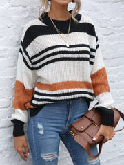 Casual striped knit sweater with color block accents in black, white, and rust orange acrylic.