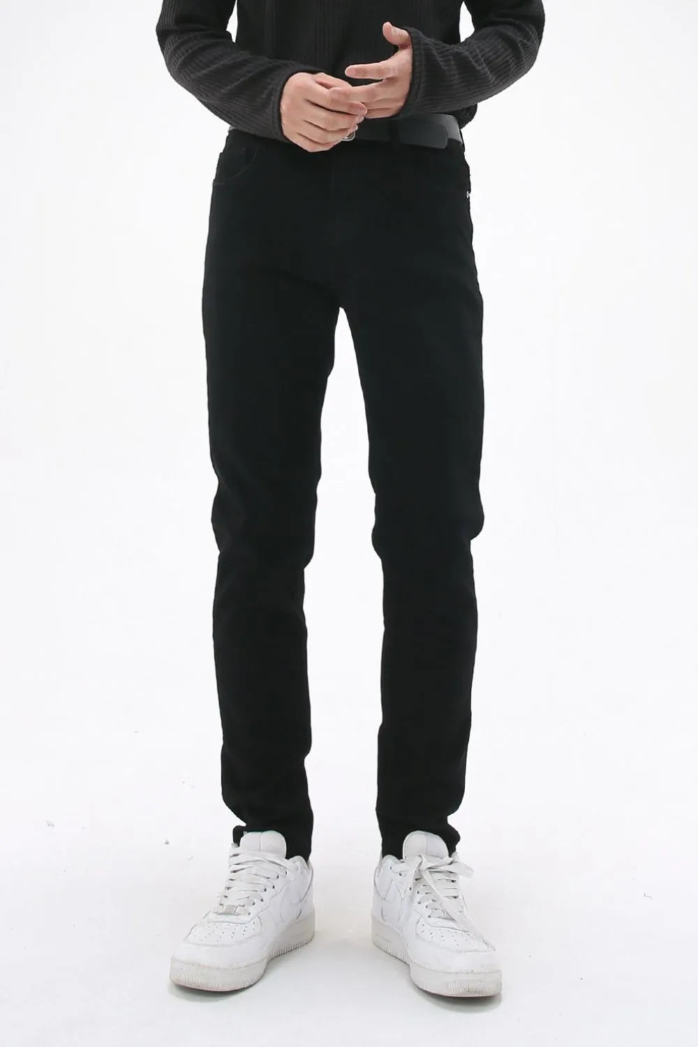 Black slim-fit stretch denim trousers with a casual cut.