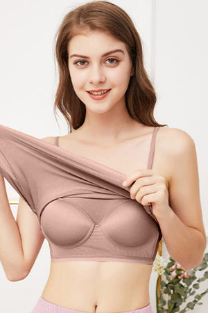 Seamless scoop neck camisole in blush pink with built-in bra cups.
