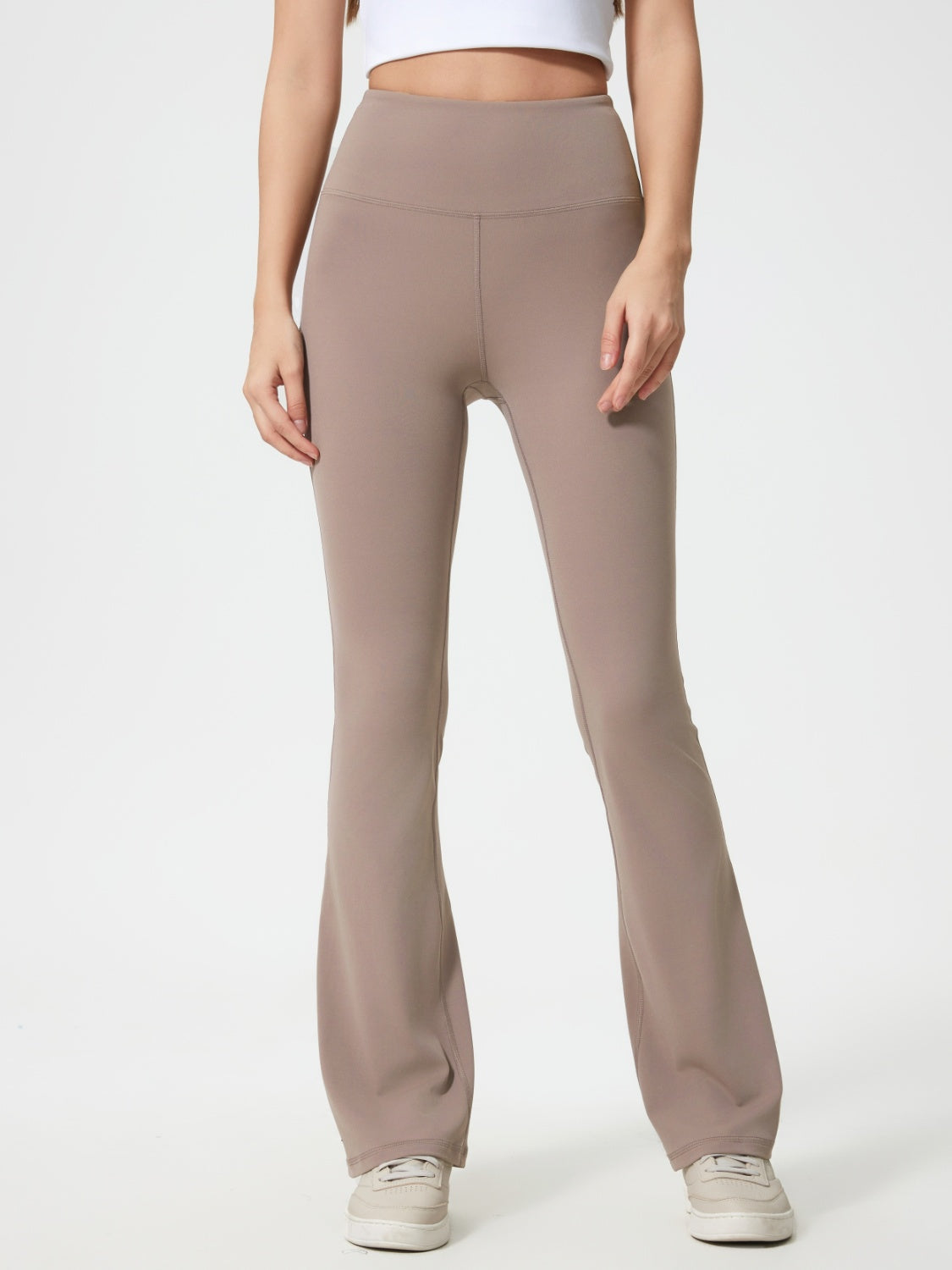 Flared sculpt leggings in mocha with high-rise waist and subtle seam details.