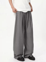 Grey plaid wide-leg joggers with adjustable drawstring waist.
