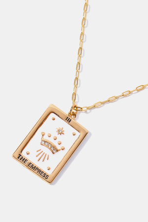 Tarot card pendant necklace with crown detail and gold chain.