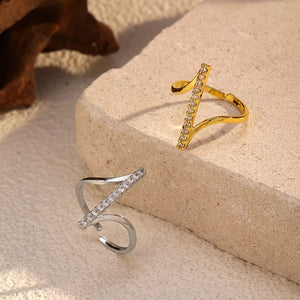 Contemporary gold and gray rings with rhinestone embellishments