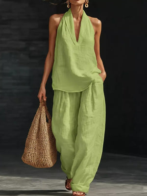 Light green halter neck top and flowing wide-leg pants set with a deep V-neck.