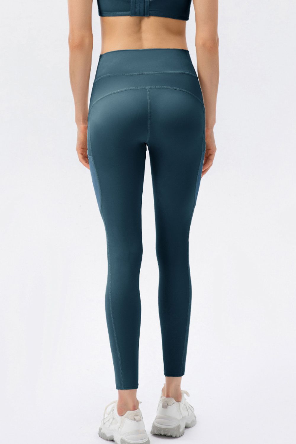 Deep Teal mesh pocket performance leggings with a high waist.