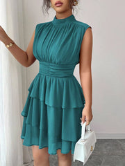 Sleeveless ruffled tiered dress in Lake Green with ruched bodice and waist.