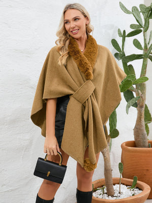 Camel faux fur collar wrap poncho with tie detail and pom-pom trim.