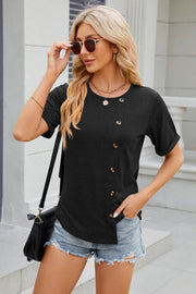 Black asymmetric button-up tee with short sleeves and a rounded neckline.