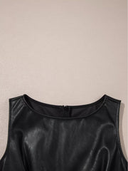 Black vegan leather sleeveless mini dress with round neckline and zipper detail.