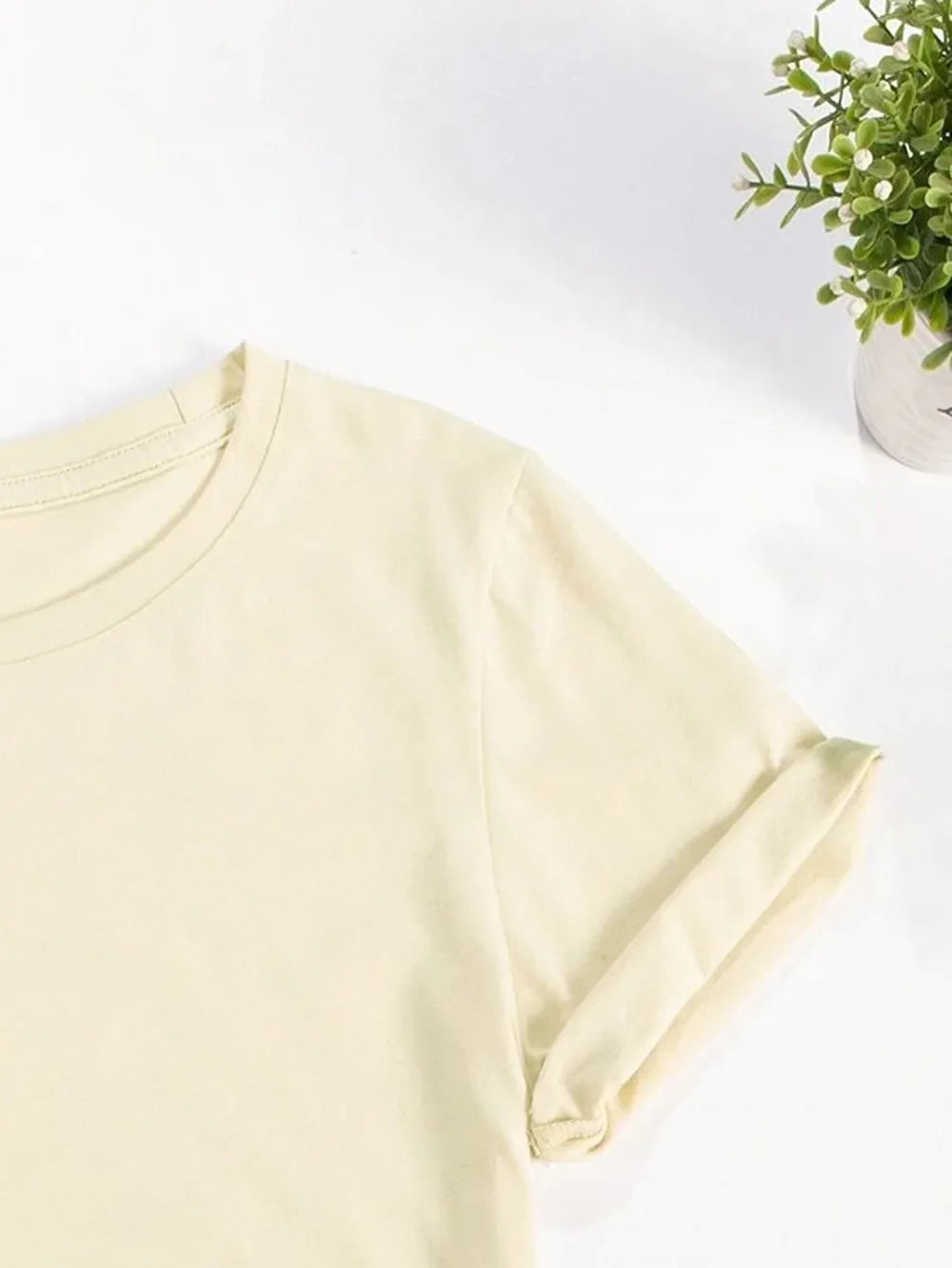 Light Yellow crew neck t-shirt with rolled sleeves and a shamrock flag graphic.