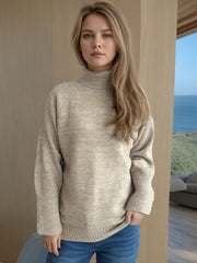 Khaki ribbed turtleneck sweater with a subtle sparkle detail and cuffed sleeves.