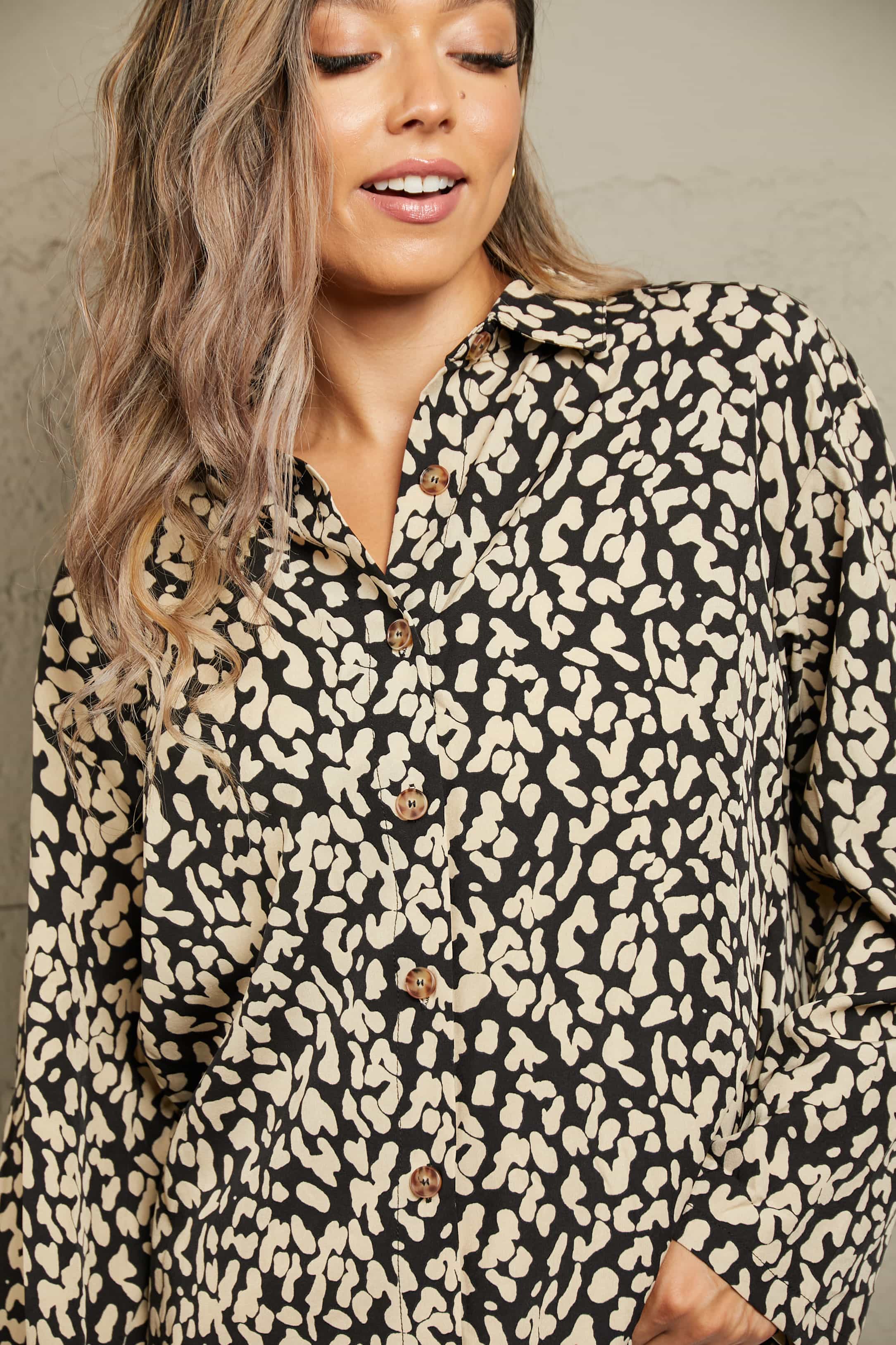 Black abstract spot print oversized shirt with button front and collar.