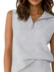 Light gray sleeveless quarter-zip top with asymmetrical skort detail
