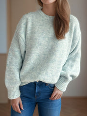 Oversized crewneck sweater in light green textured knit with ribbed cuffs and hem.
