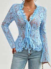 Light blue lace tie-front blouse with ruffled neckline and cuffs.