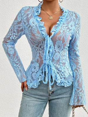 Light blue lace tie-front blouse with ruffled neckline and cuffs.