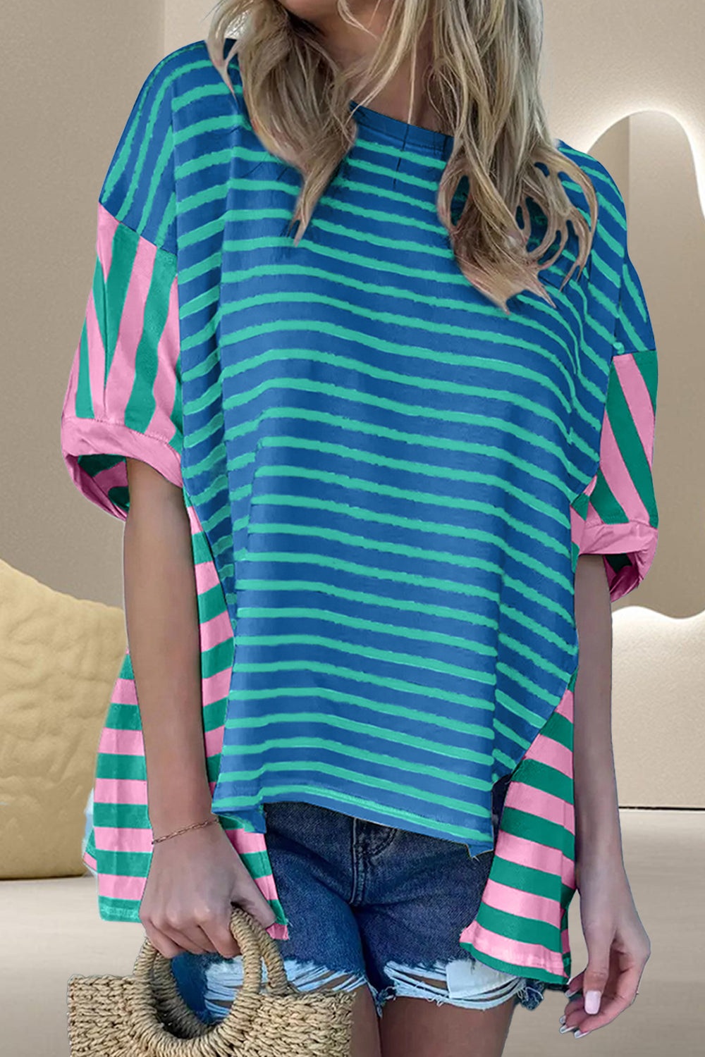 Asymmetric stripe panel tee in cerulean with pink and green stripes, short sleeves, and a relaxed fit.
